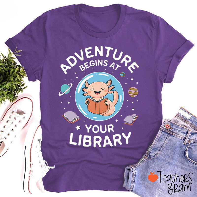 Adventure Begins At Your Library Teacher T-Shirt