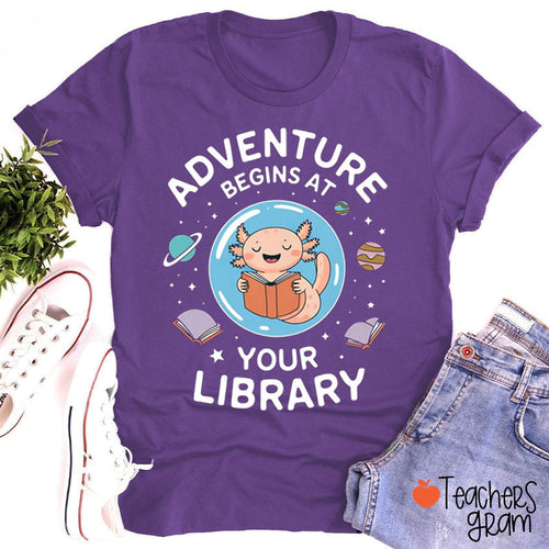 Adventure Begins At Your Library Teacher T-Shirt