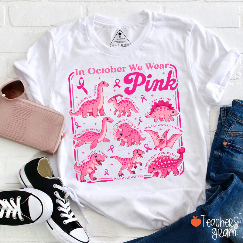 In October We Wear Pink Dinosaur Pink Ribbon Graphic Teacher T-Shirt