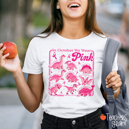 In October We Wear Pink Dinosaur Pink Ribbon Graphic Teacher T-Shirt