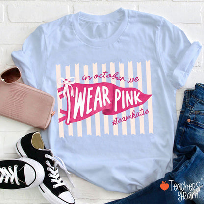 Personalized In October We Wear Pink Pink Stripe Flag Bow Teacher T-Shirt