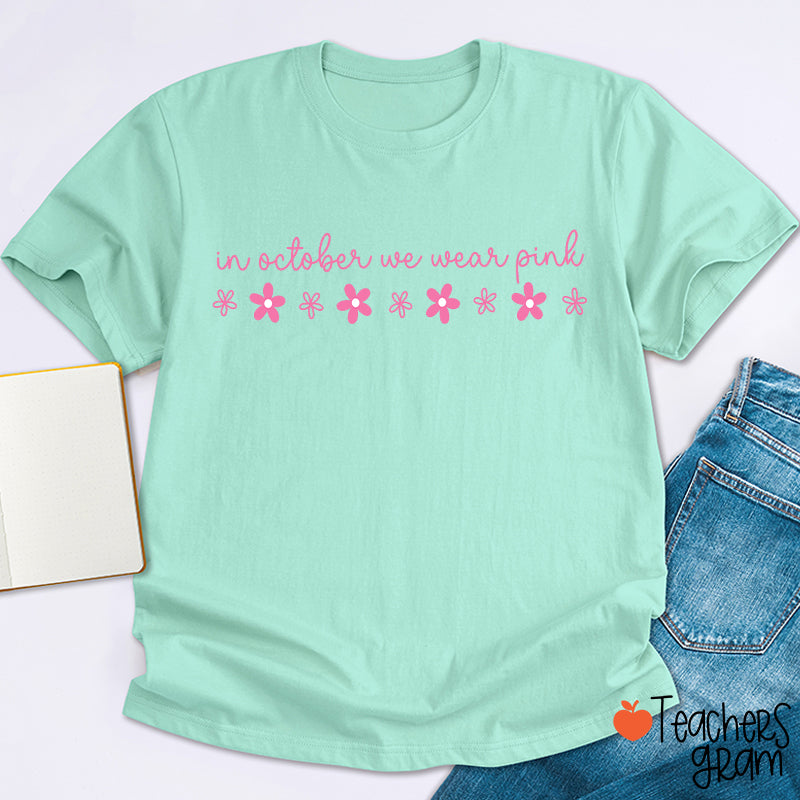 In October We Wear Pink Handwritten Script Daisy Floral Fall Teacher T-Shirt